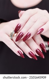 Female Hands With Long Nails And Dark Red Nail Polish