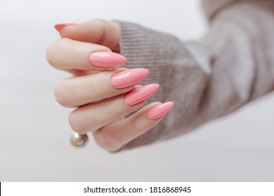 Female Hands With Long Nails With Pink Nail Polish