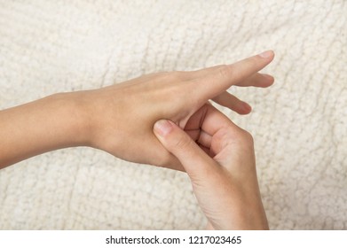 Female Hands Make Acupressure On The Arm