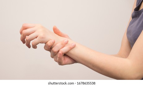 Female Hands Make Acupressure On The Arm