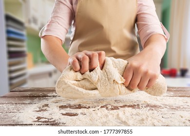 Female hands making dough for baking - Powered by Shutterstock