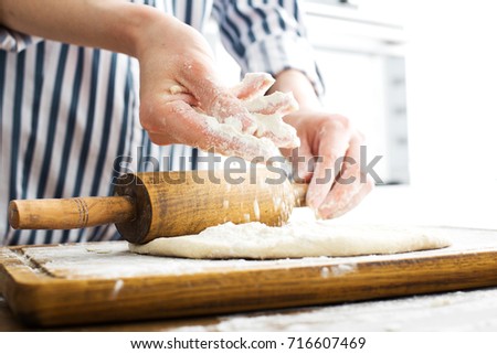 Similar – woman kneading bread dough with her hands