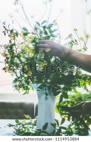 Similar – Female hands holding flower vase with wild flowers