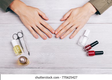 Female Hands And Manicure Accessories On The Table Top View