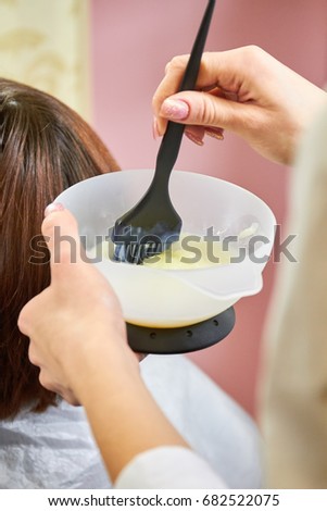 female hands mixing hair