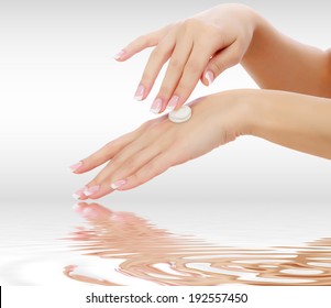 Female Hands With A Moisturiser On Light Grey Background 