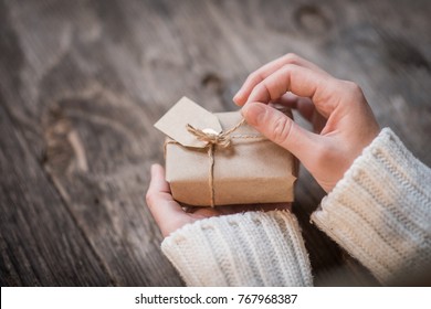 Female Hands Opening Gift Box  As Holiday Background