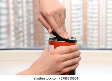 Female Hands Opening The Lid Of A Food Jar