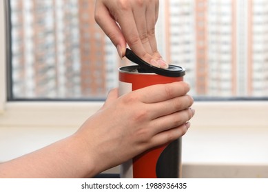 Female Hands Opening The Lid Of A Food Jar