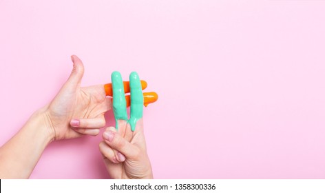 Female Hands In Paint Crossed In A Hashtag Sign On A Colored Background, Creative Advertising, Social Networks Concept