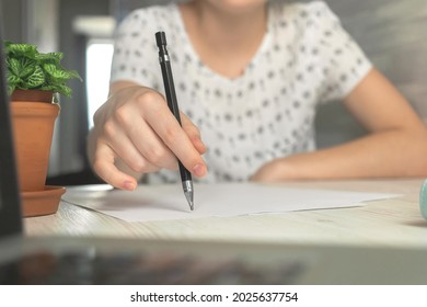 Female Hands With Pencel Writing On A Notebook. Office Desk Workspace Background 