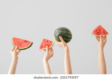 Female hands with pieces of ripe watermelon on white background - Powered by Shutterstock