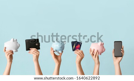 Similar – Image, Stock Photo Woman holding colorful wallets against yellow background