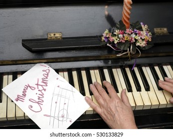 Female Hands Playing On A Retro Looking Piano, Christmas Background, Indoor Overhead Shot