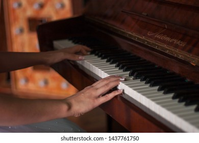 Female Hands Playing The Piano