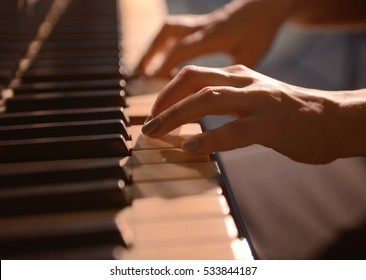 Female Hands Playing Piano