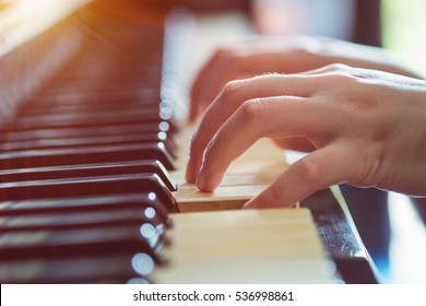 Female Hands Playing Piano