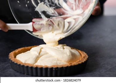 Female Hands Pour Out Cheese In Finely Ground Bread Of The Blueberry Cheese Cake. Process Of Making Delicious Homemade Blueberry Cheese Cake. Cooking A Blueberry Cheese Cake At Home.