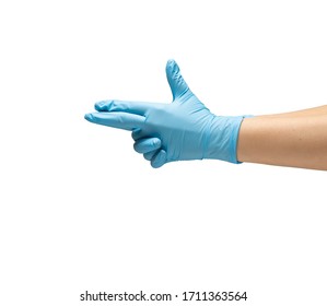 Female hands in protective rubber gloves of blue color show a gun symbol weapons. Isolate on a white background. - Shutterstock ID 1711363564