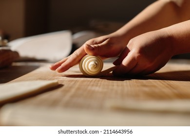 Female Hands Rolling Dough into Rolls, Baking Process Making Croissant. Selected Focus, Concept for Bakery