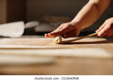 Female Hands Rolling Dough into Rolls, Baking Process Making Croissant. Selected Focus, Concept for Bakery - Powered by Shutterstock