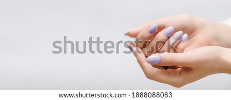 Female hands with rose nail design. Pink glitter nail polish manicure on white background. Nail design copy space