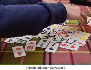 Female hands are shuffling board game cards - Shutterstock ID 1879153885