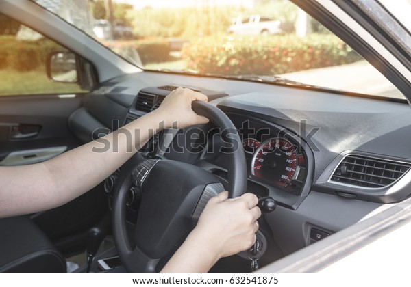 Female hands and steering wheel - Hand-drive
concept : vintage filter