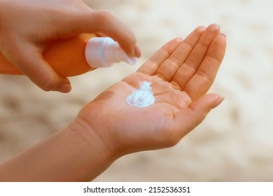 Female Hands With Sun Protection Cream Skin Care Concept.  Sunscreen Solar. The Girl Uses  Moisturizer Sunblock.