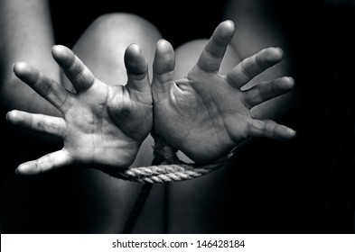 Female Hands Tied Up With Rope Of A Missing Kidnapped, Abused, Hostage, Victim, Woman ,restricted, Trapped,horror, Help, Struggle, Terrified, Threaten, Locked, Freedom, Liberty Concept.Copy Space