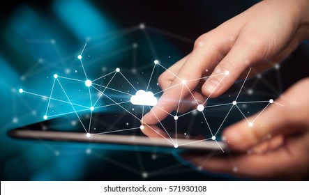 Female hands touching tablet with white cloud concept - Shutterstock ID 571930108