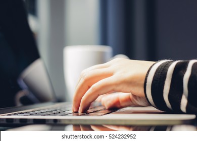 Female hands typing on keyboard of computer laptop, work from home and self quarantine concept, prevent spread of pandemic Covid-19 and Coronavirus