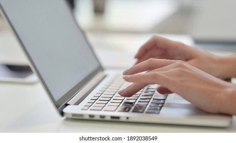 Female Hands Typing On Laptop, Side View