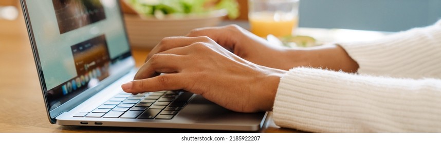 Female Hands Typing On Laptop Keyboard Closeup