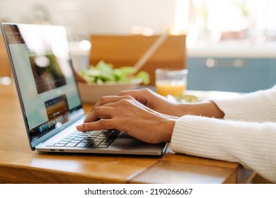 Female Hands Typing On Laptop Keyboard Closeup