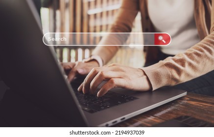 Female Hands Typing On Laptop While Sitting At Office Desk Indoors. Chatting In Facebook, Searching Information, Browsing. Technology Concept