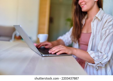 Female Hands Typing On Laptop Keyboard Closeup