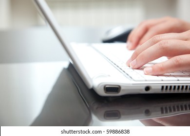 Female Hands Typing On A Laptop