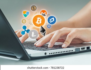 female hands typing on laptop. Bitcoin, ethereum and altcoin logos flying on air. cryptocurrency concept