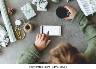 Female hands typing on mobile phone