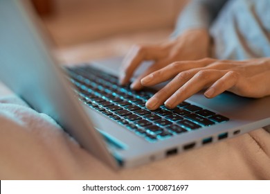 female hands typing text on laptop computer, searching information in social networks, female keyboarding text using netbook for chatting. Concept remote work, technology.