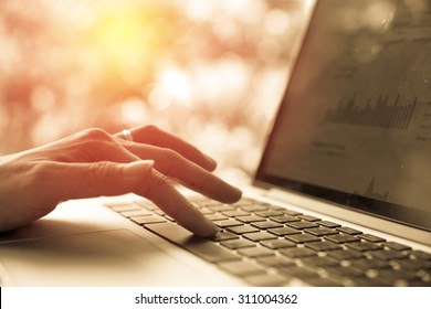 female hands using computer laptop. Vintage filter - Shutterstock ID 311004362