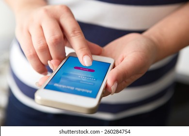 Female Hands Using Mobile Banking On White Smartphone