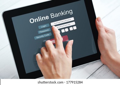 Female Hands Using Online Banking On Touch Screen Device 