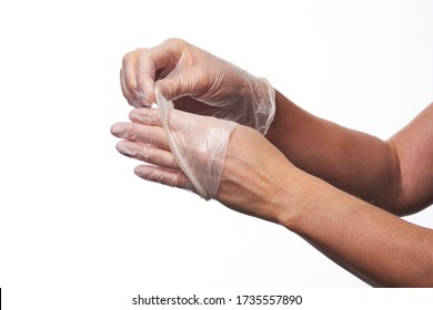 Female Hands Using Vinyl Gloves