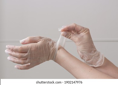 Female Hands In Vinyl Gloves Above White Background. Safety And Selfcare Concept