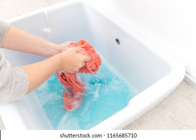 Female Hands Washing Color Clothes In Sink