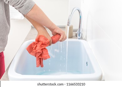 Female Hands Washing Color Clothes In Sink