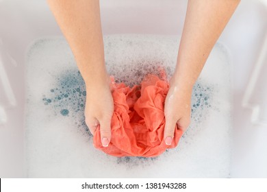 Female Hands Washing Color Clothes In Sink