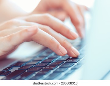 Female hands or woman office worker typing on the keyboard - Shutterstock ID 285808313